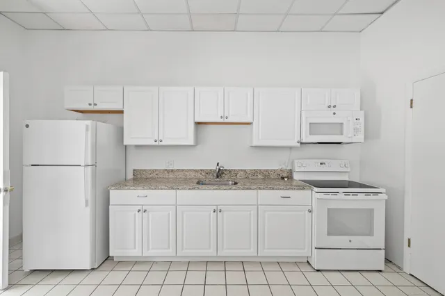 a view of a city street with cars