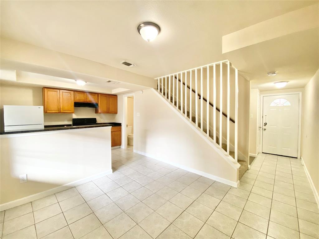 8001 C Rothington Road, Unit 21 Dallas, TX 75227 - Photo 6 of 32 a view of a kitchen with wooden floor
