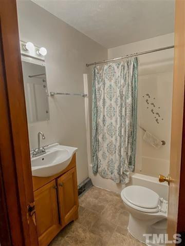 217 Lake Drive Roxboro, NC 27573 - Photo 11 of 20 a bathroom with a sink toilet and shower