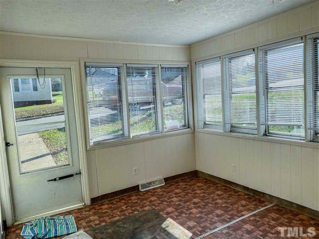 217 Lake Drive Roxboro, NC 27573 - Photo 2 of 20 a view of an empty room with a window