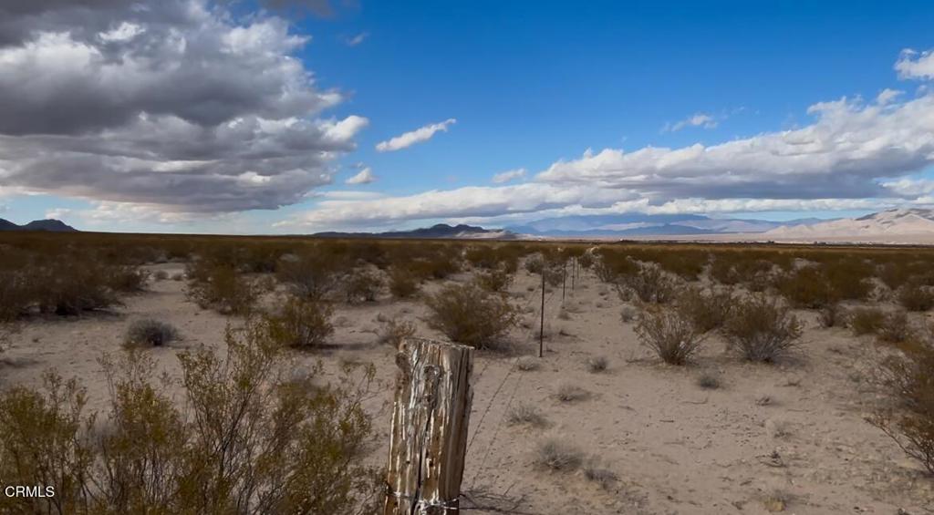 26 Cheyene Baker, CA 92309 - Photo 16 of 38 a view of a dry yard with wooden fence