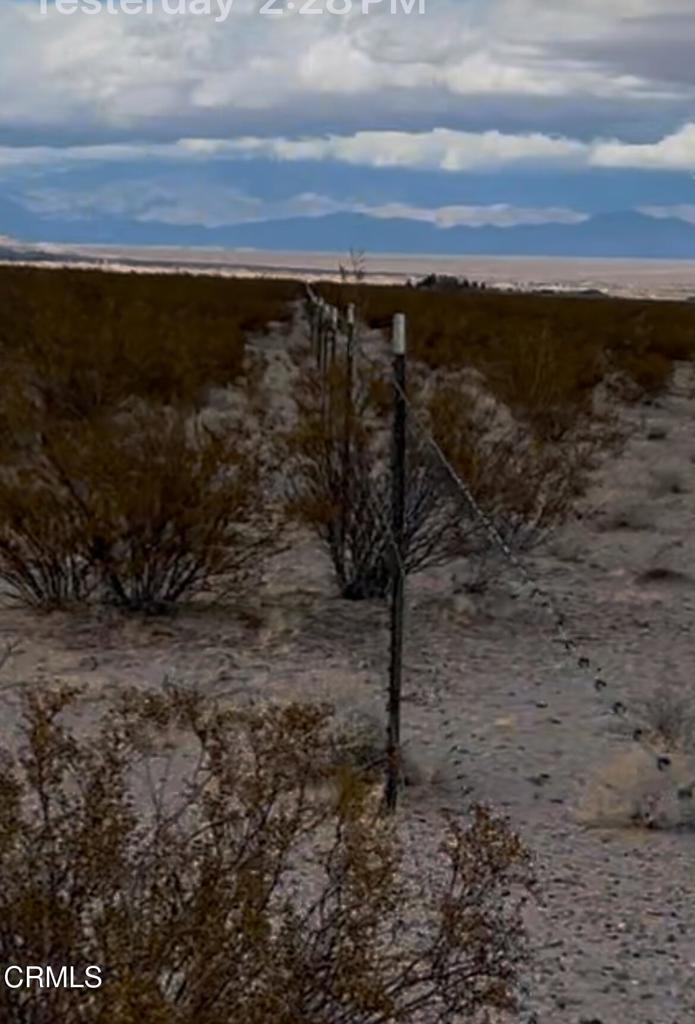 26 Cheyene Baker, CA 92309 - Photo 26 of 38 a view of a dry yard with wooden fence