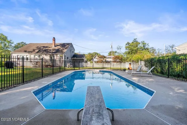 a view of a swimming pool with a terrace