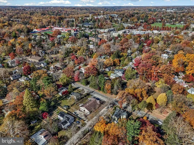 an aerial view of a house with yard