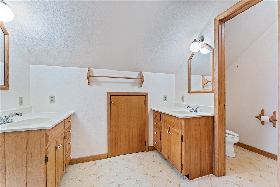 13258 Raccoon Road Granby, MO 64844 - Photo 29 of 37 Full bathroom featuring light floors and two vanities