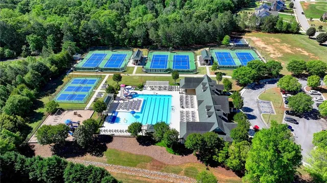 a aerial view of a house with swimming pool and garden