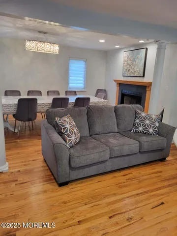 a living room with furniture and a fireplace