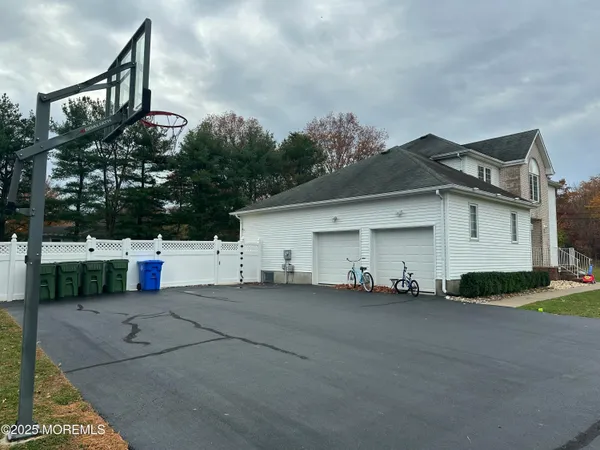 a white house that has a tree in front of it