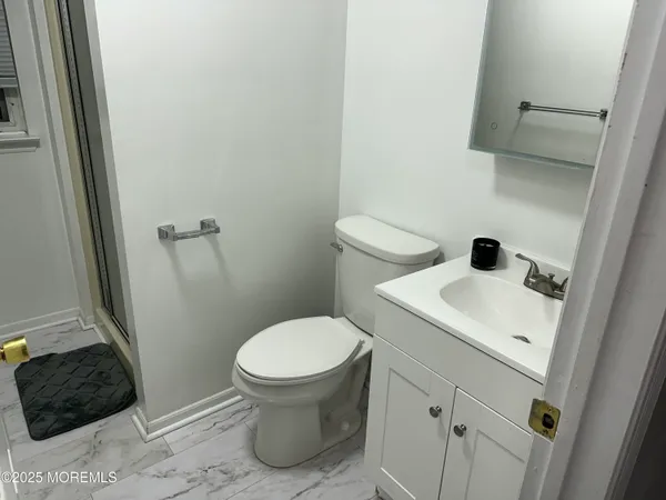 a bathroom with a sink and a toilet
