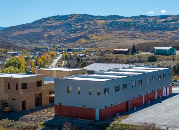 aerial view of a house with a yard