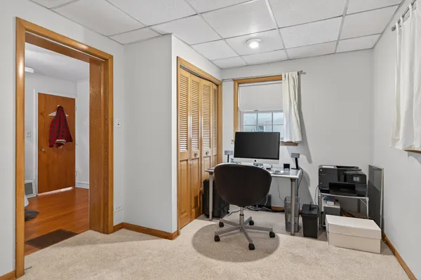 a workspace with furniture and window