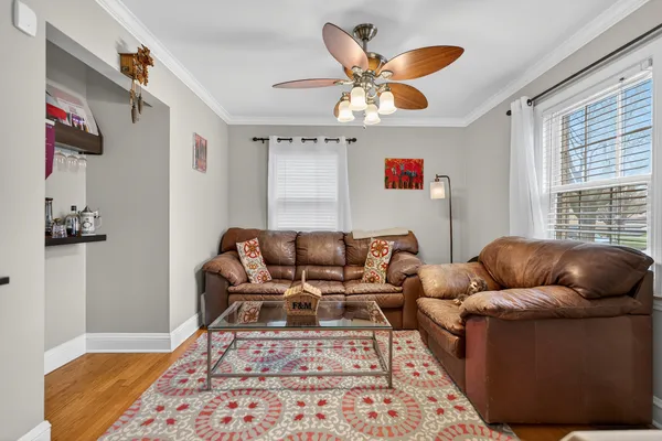 a living room with furniture and a rug