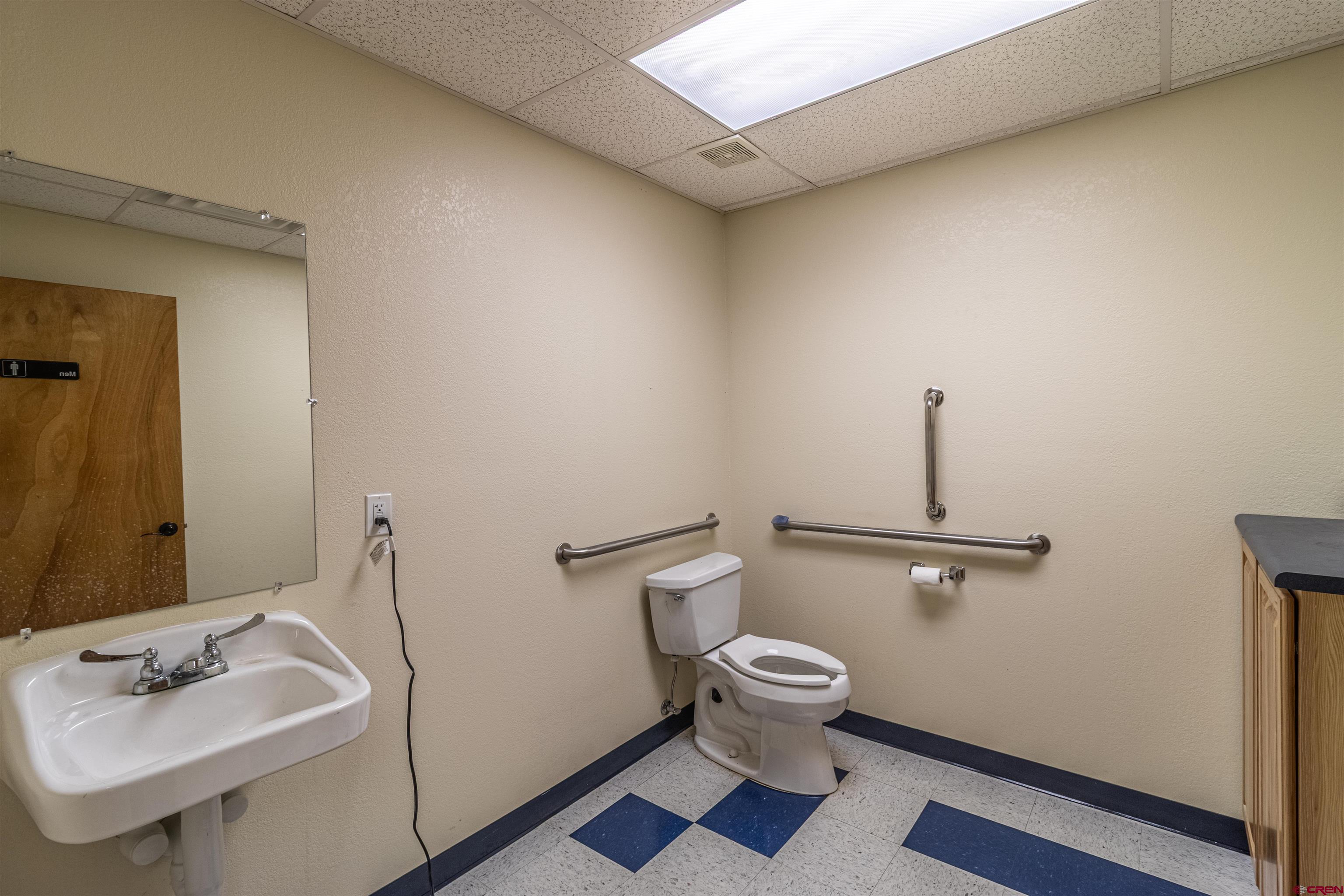 60 County Road 3961 Farmington, NM 87401 - Photo 16 of 35 a bathroom with a sink and a mirror