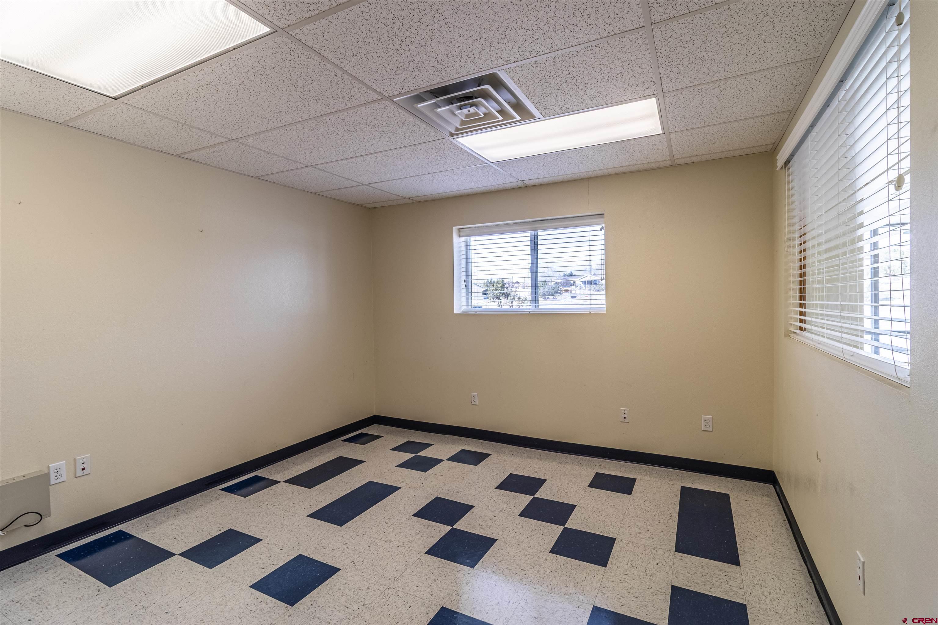 60 County Road 3961 Farmington, NM 87401 - Photo 18 of 35 a view of a room with wooden floor and black walls