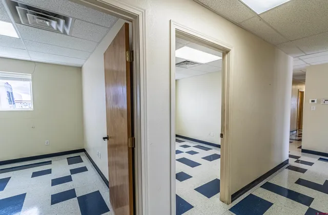 a view of a bathroom with a sink and a mirror