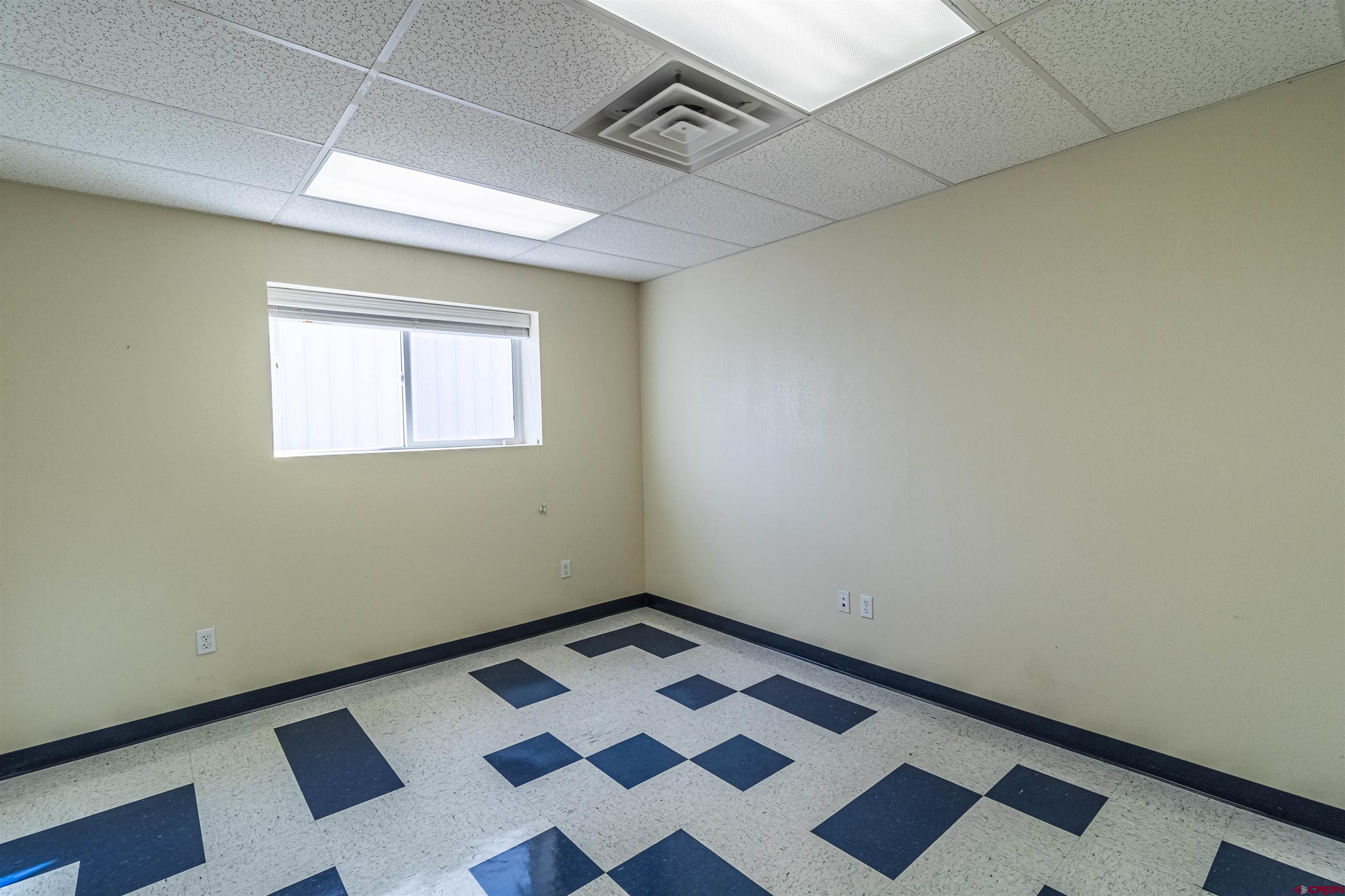 60 County Road 3961 Farmington, NM 87401 - Photo 22 of 35 a view of a room with wooden floor and black white walls