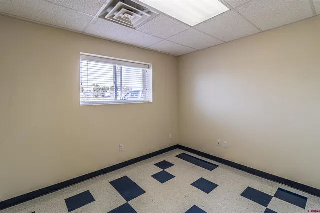 a view of an empty room and a window