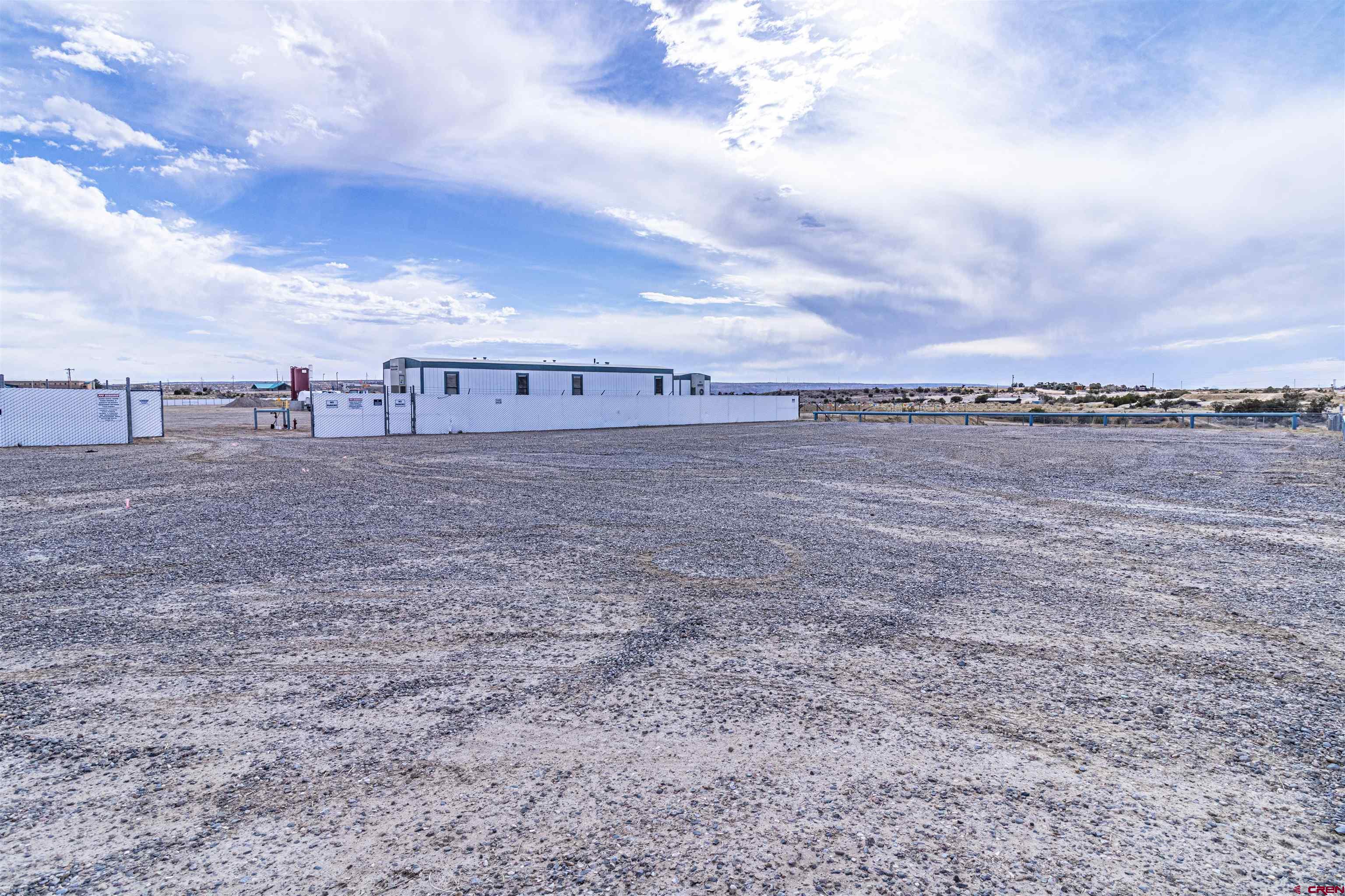 60 County Road 3961 Farmington, NM 87401 - Photo 6 of 35 a view of a dry yard with large trees