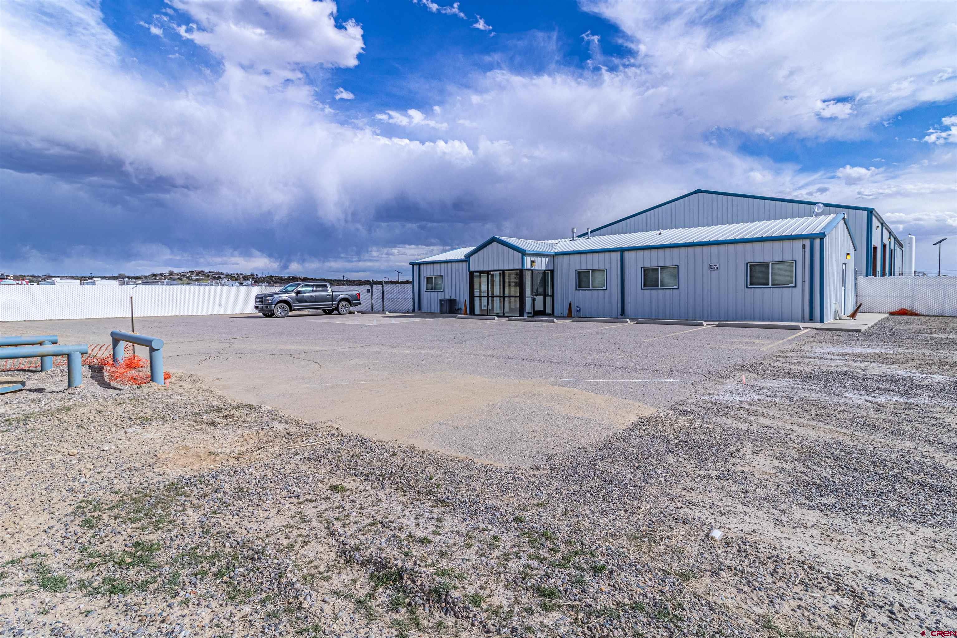 60 County Road 3961 Farmington, NM 87401 - Photo 7 of 35 a view of a house with large trees and a big yard
