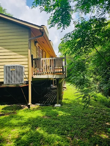 a view of house with backyard