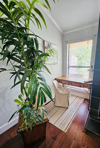 a white bath tub sitting in a bathroom next to a window