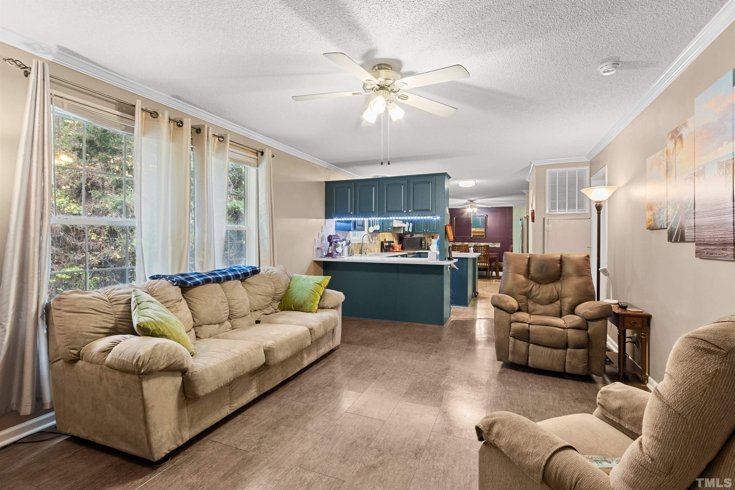 2710 Hurdover Road Apex, NC 27539 - Photo 14 of 52 a living room with furniture and a large window