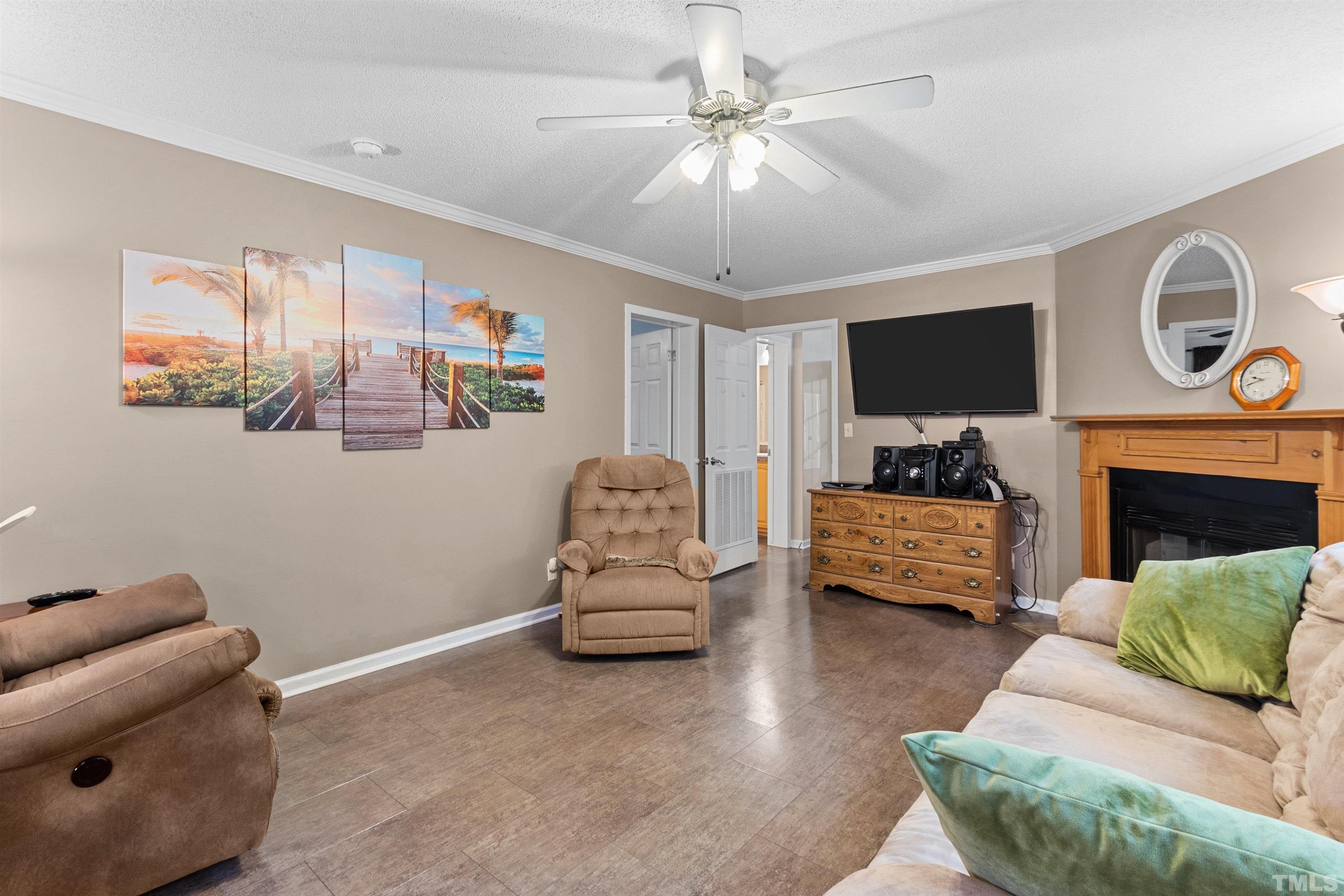 2710 Hurdover Road Apex, NC 27539 - Photo 16 of 52 a living room with furniture and a fireplace