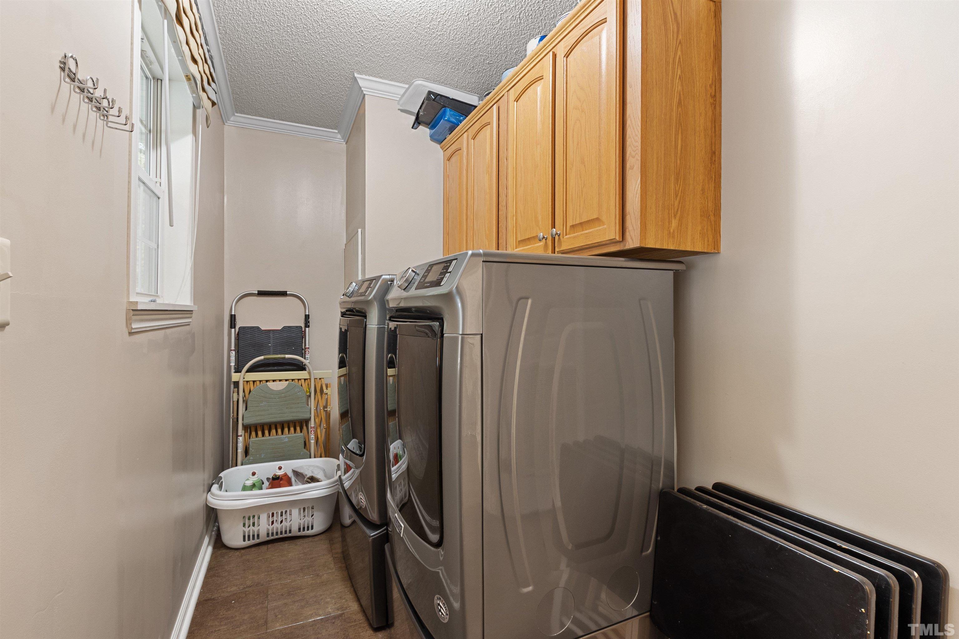 2710 Hurdover Road Apex, NC 27539 - Photo 18 of 52 a bathroom with a sink a toilet and mirror