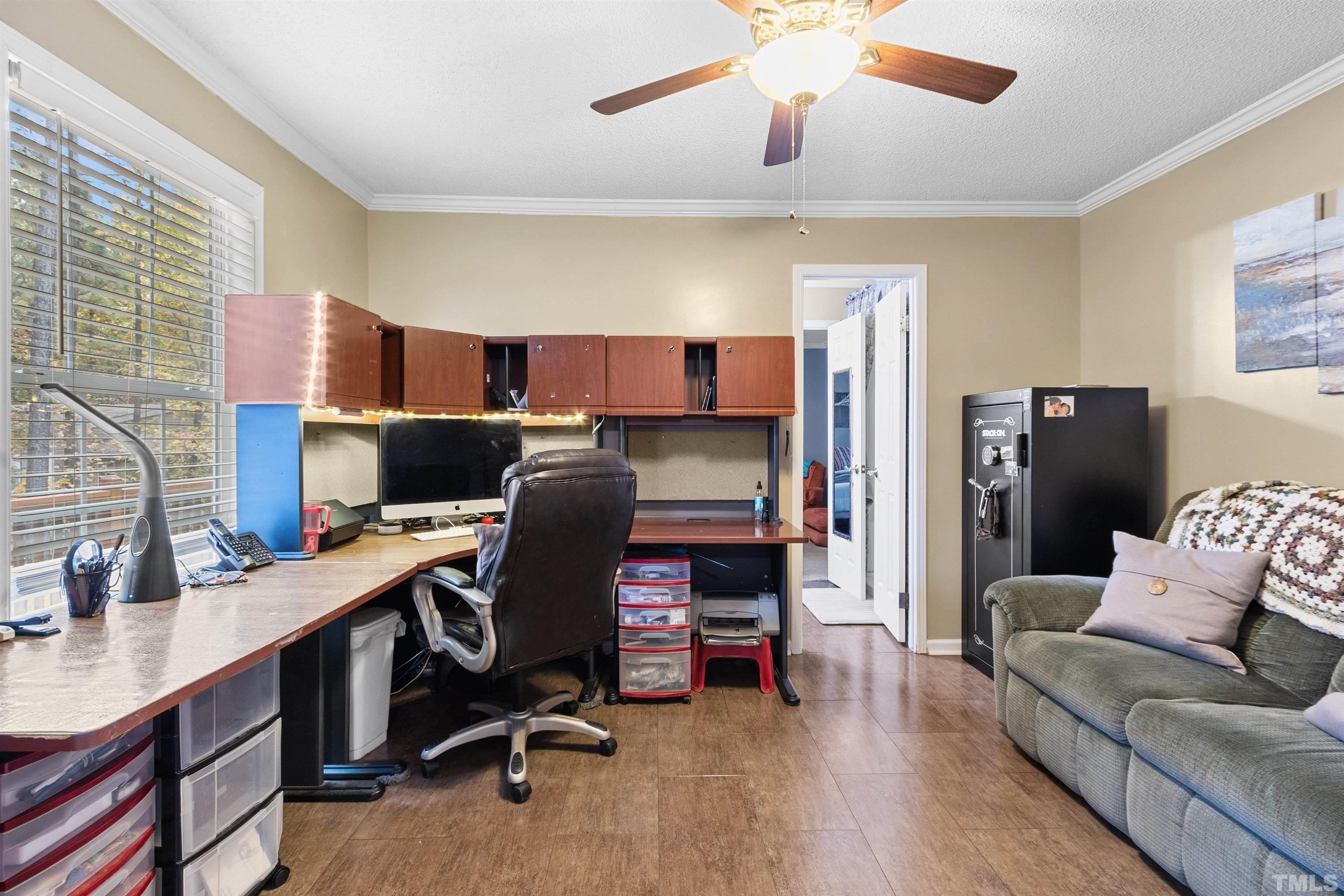 2710 Hurdover Road Apex, NC 27539 - Photo 20 of 52 a view of a workspace with furniture and a window