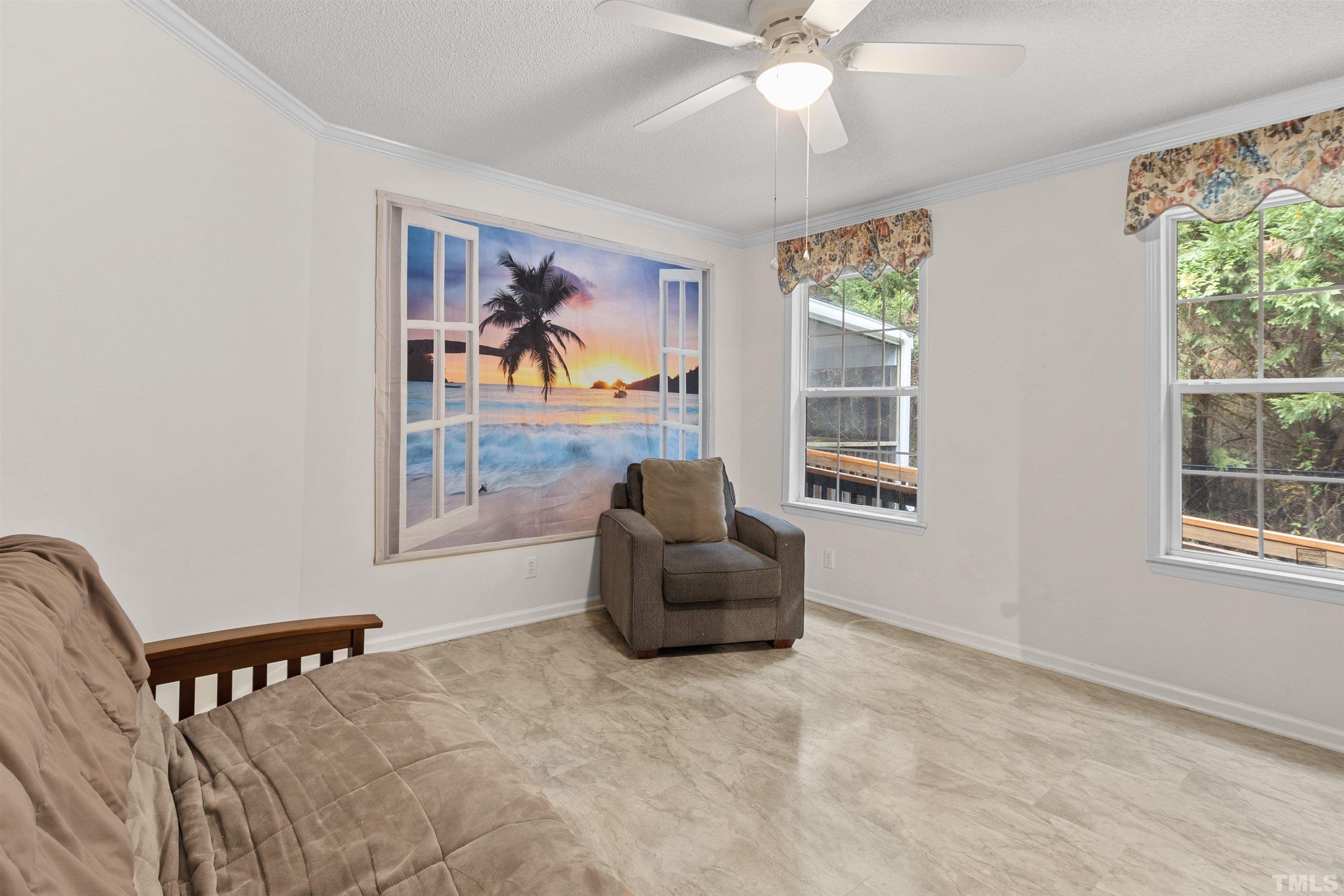 2710 Hurdover Road Apex, NC 27539 - Photo 21 of 52 a living room with furniture and a window
