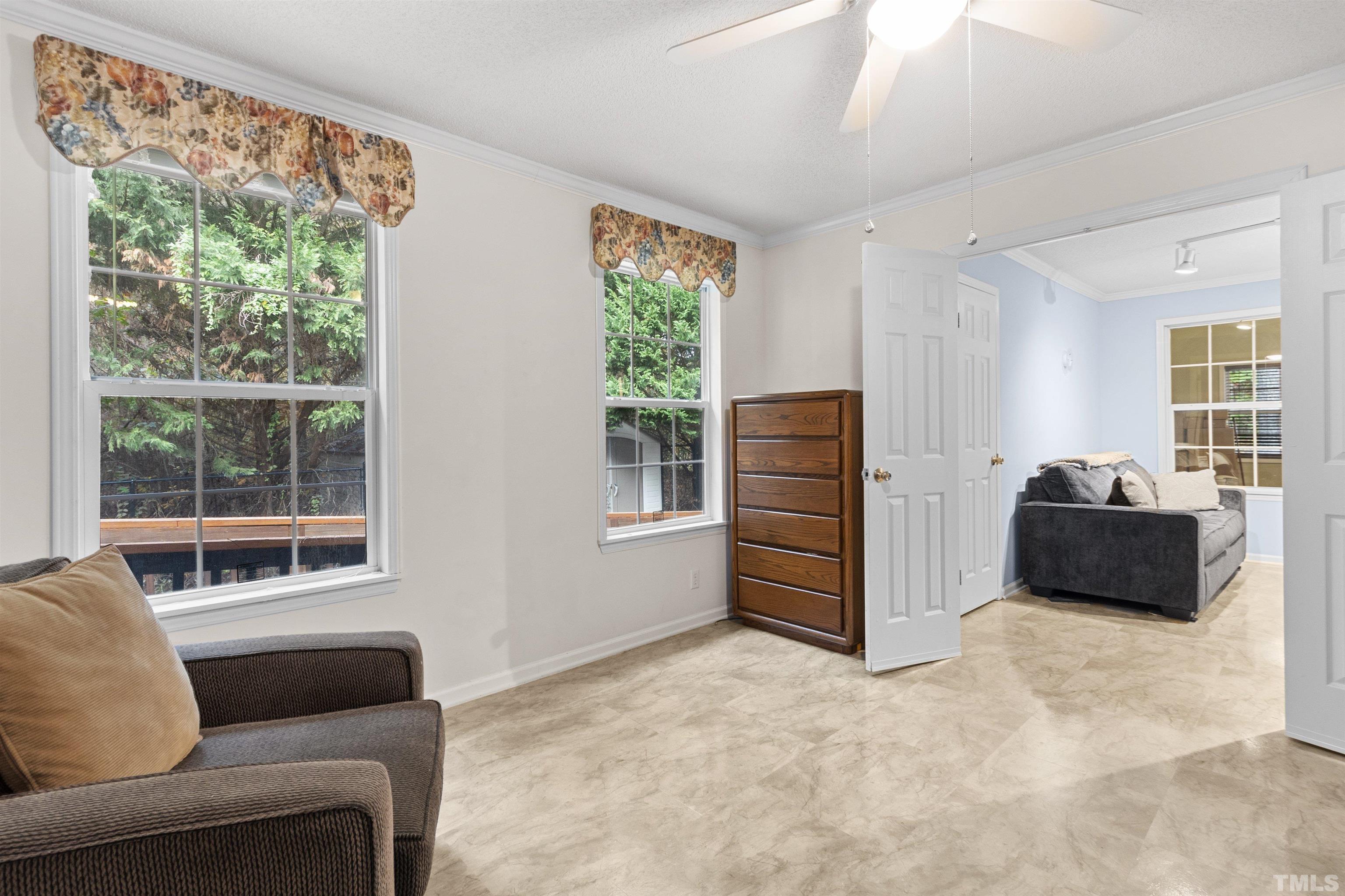 2710 Hurdover Road Apex, NC 27539 - Photo 22 of 52 a living room with furniture and a window