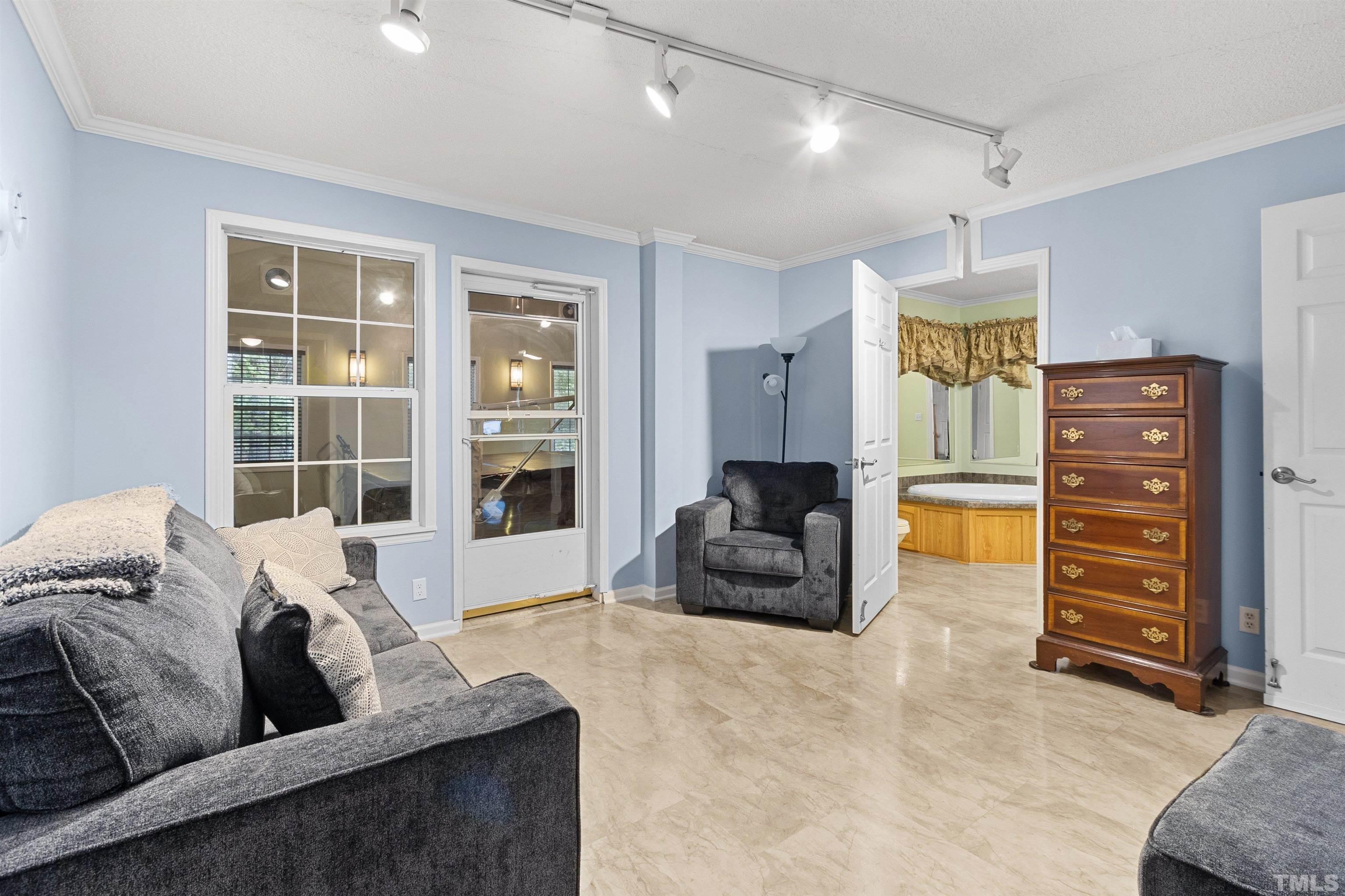 2710 Hurdover Road Apex, NC 27539 - Photo 23 of 52 a living room with furniture and a large window