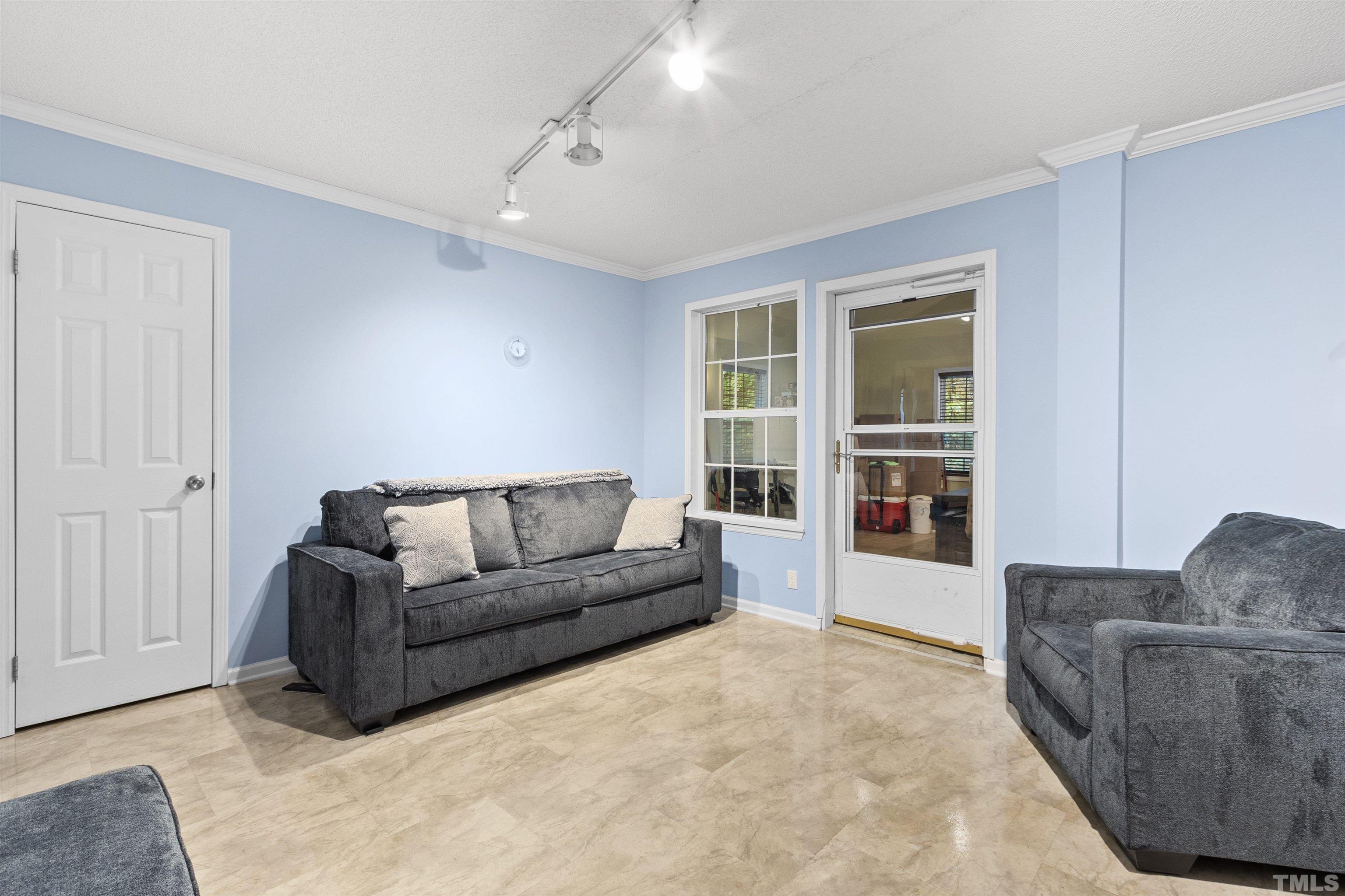 2710 Hurdover Road Apex, NC 27539 - Photo 24 of 52 a living room with furniture and a large window