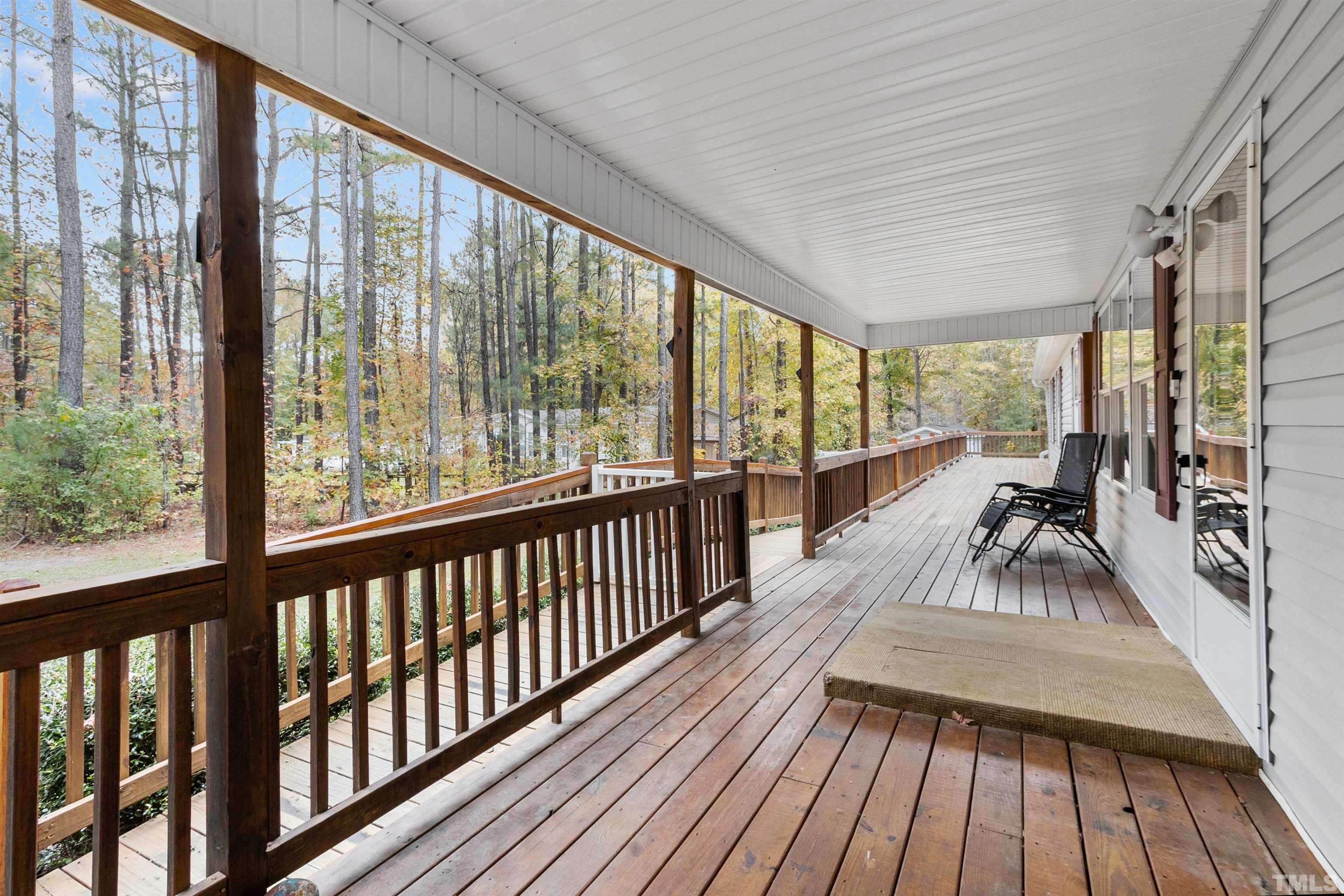 2710 Hurdover Road Apex, NC 27539 - Photo 33 of 52 a view of a living room and balcony with furniture
