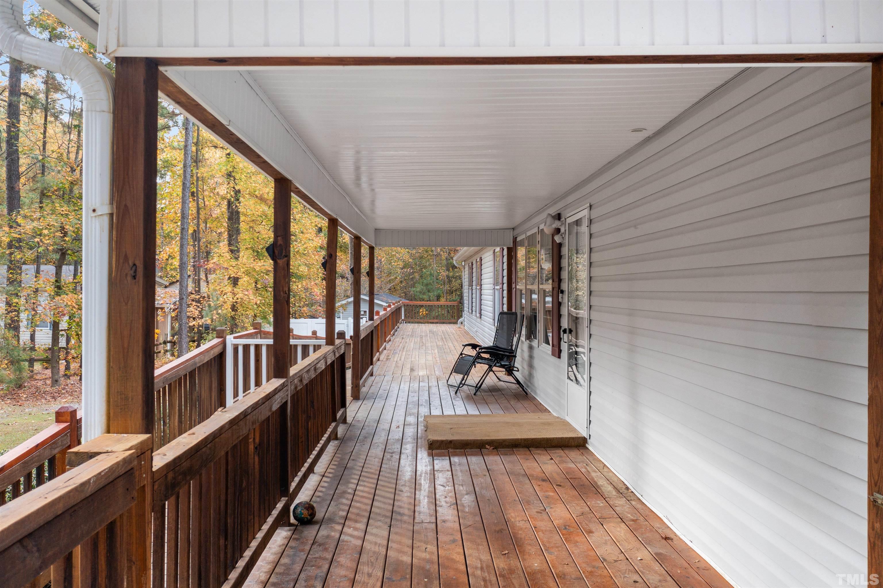 2710 Hurdover Road Apex, NC 27539 - Photo 34 of 52 a view of a balcony with couch and wooden floor