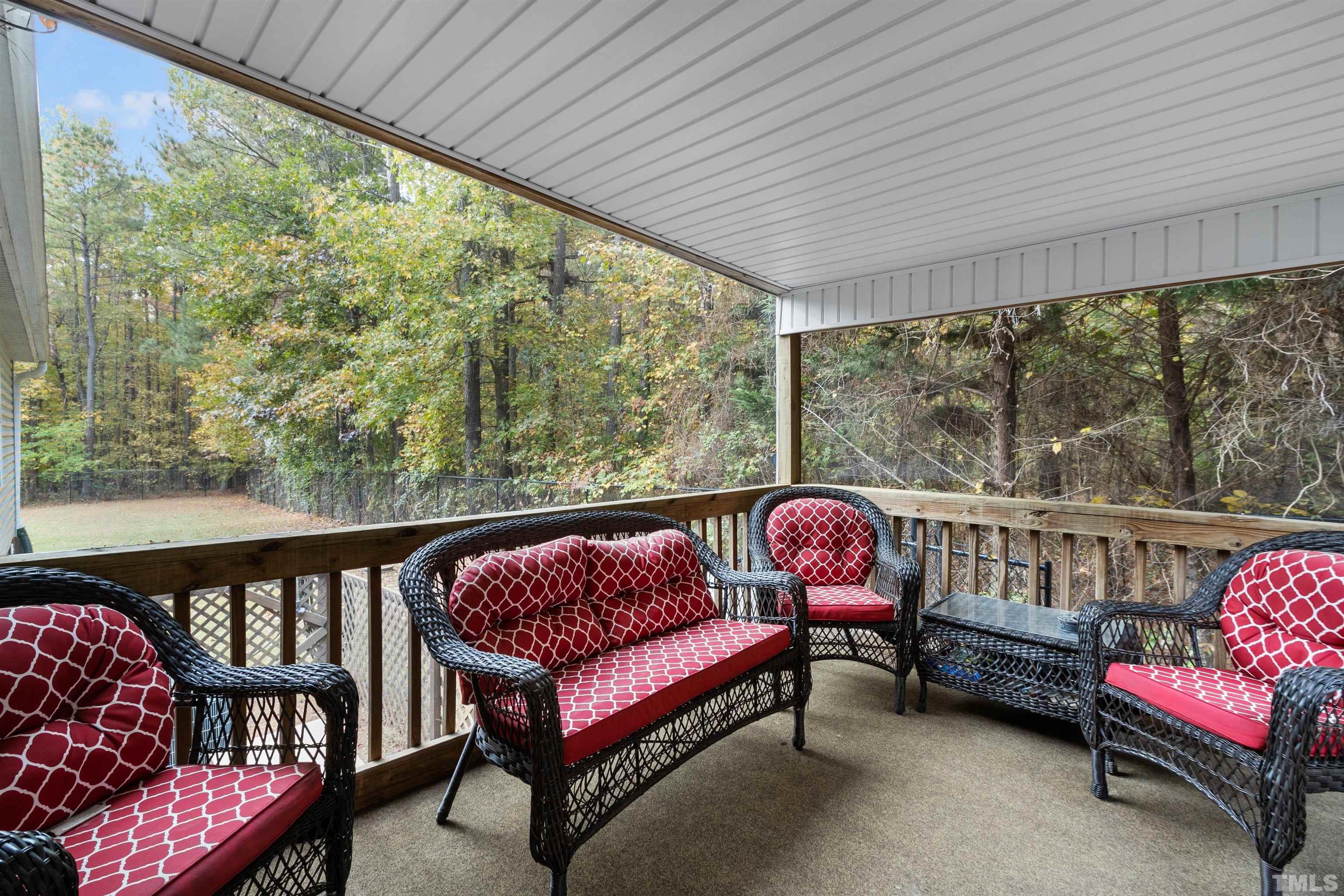 2710 Hurdover Road Apex, NC 27539 - Photo 35 of 52 a balcony with furniture and a garden