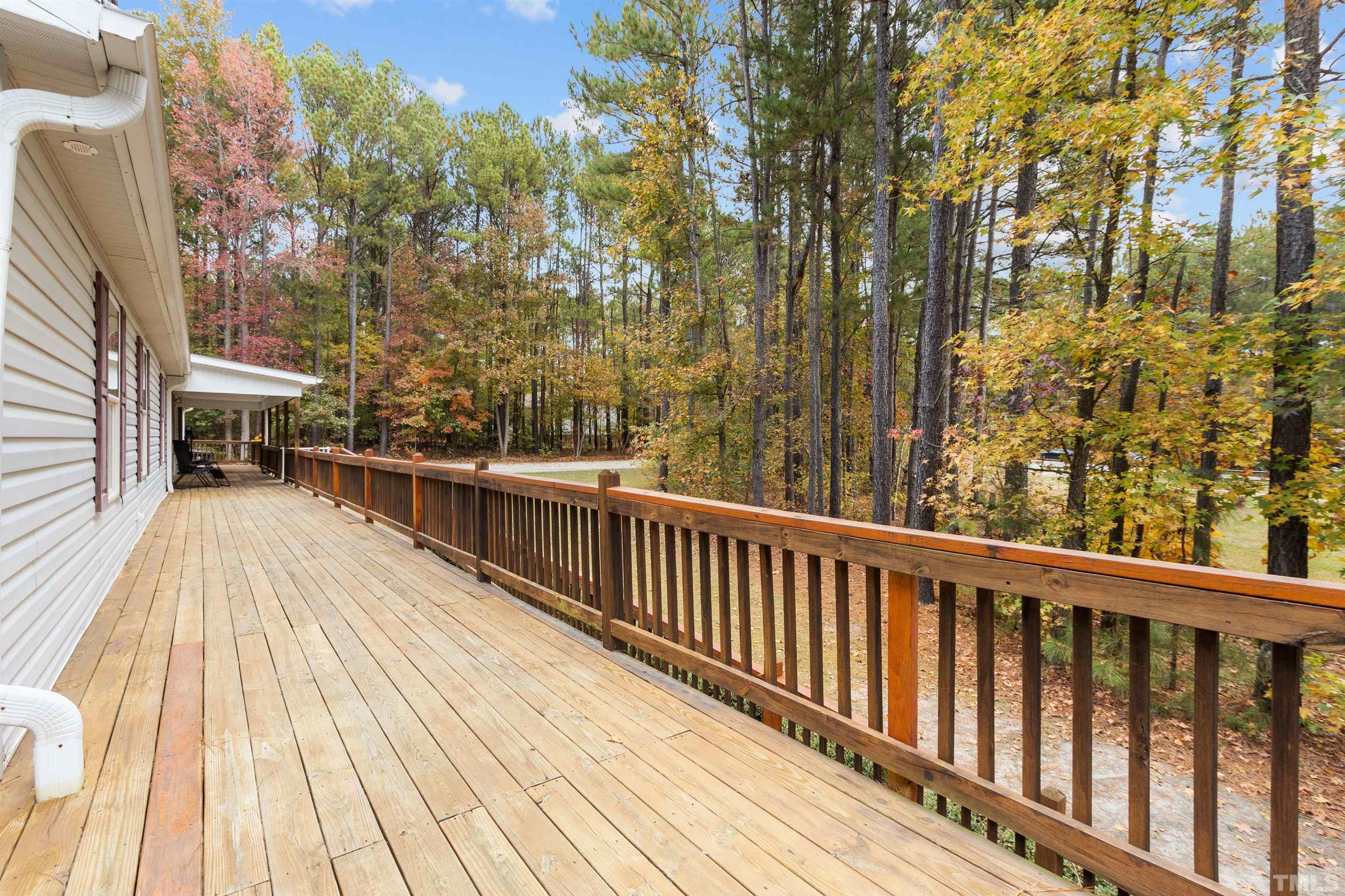 2710 Hurdover Road Apex, NC 27539 - Photo 38 of 52 a view of balcony with wooden floor and outdoor seating