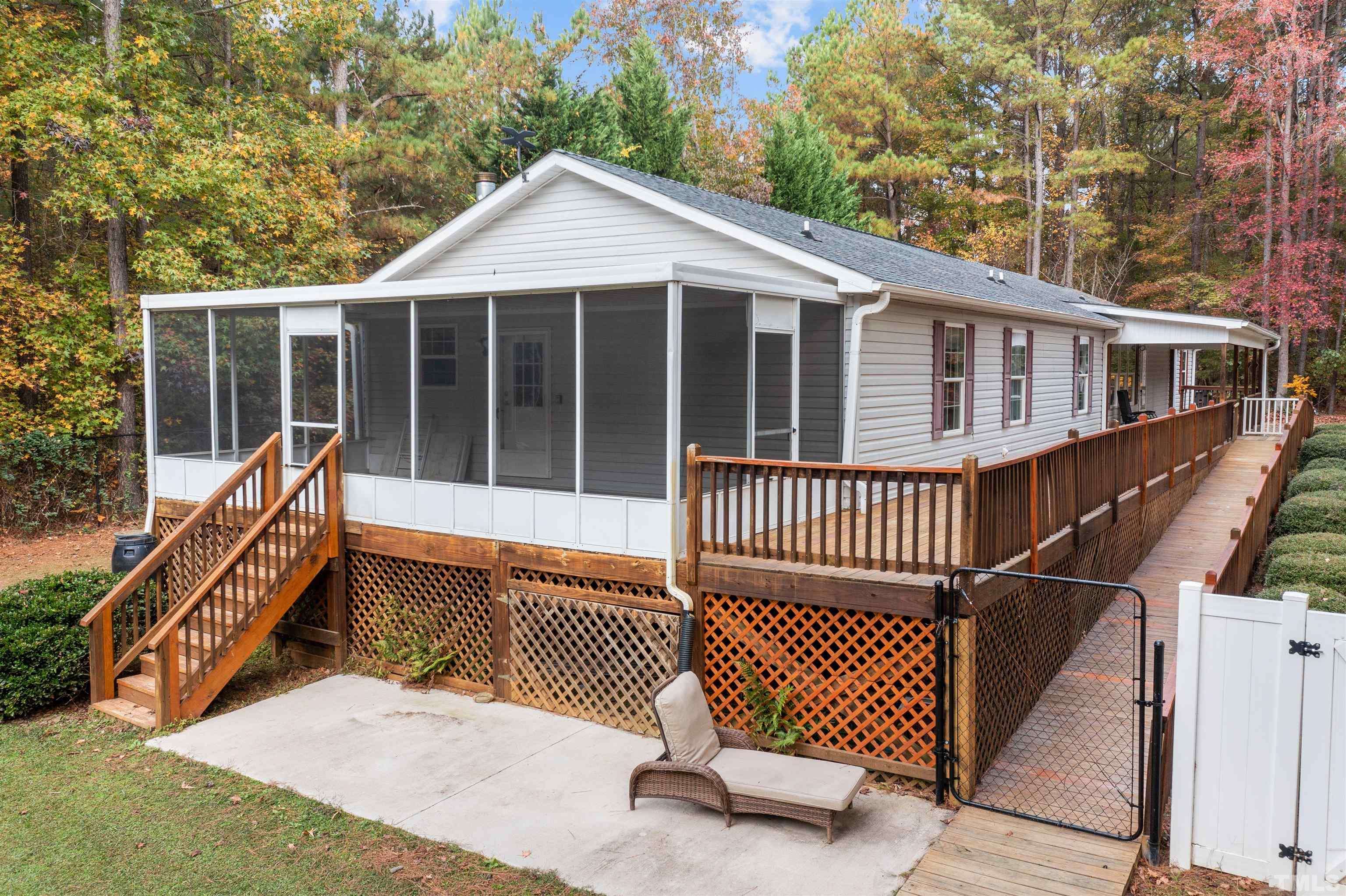 2710 Hurdover Road Apex, NC 27539 - Photo 39 of 52 a view of a house with a wooden deck