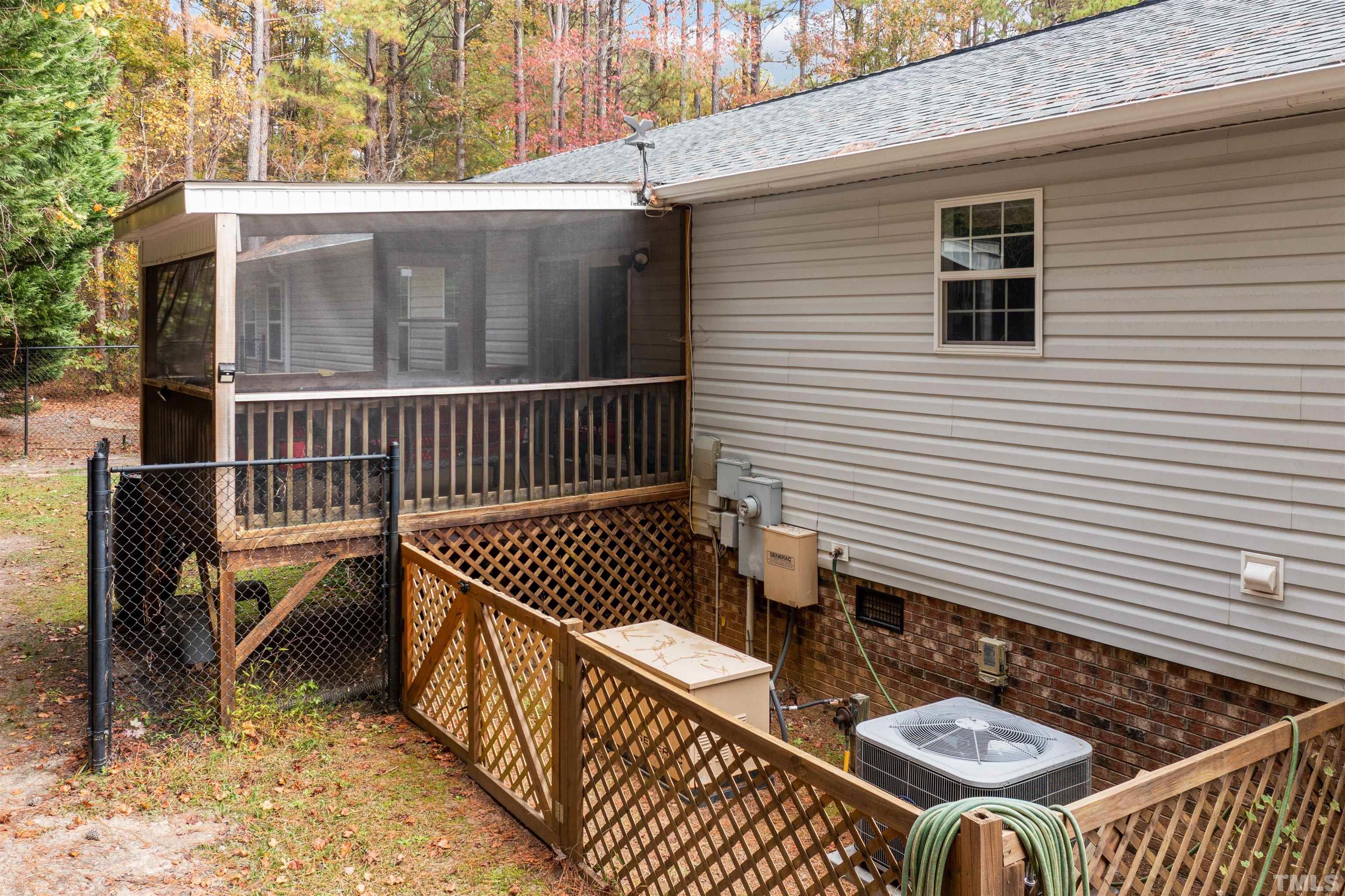2710 Hurdover Road Apex, NC 27539 - Photo 41 of 52 a view of a chairs and table on the deck