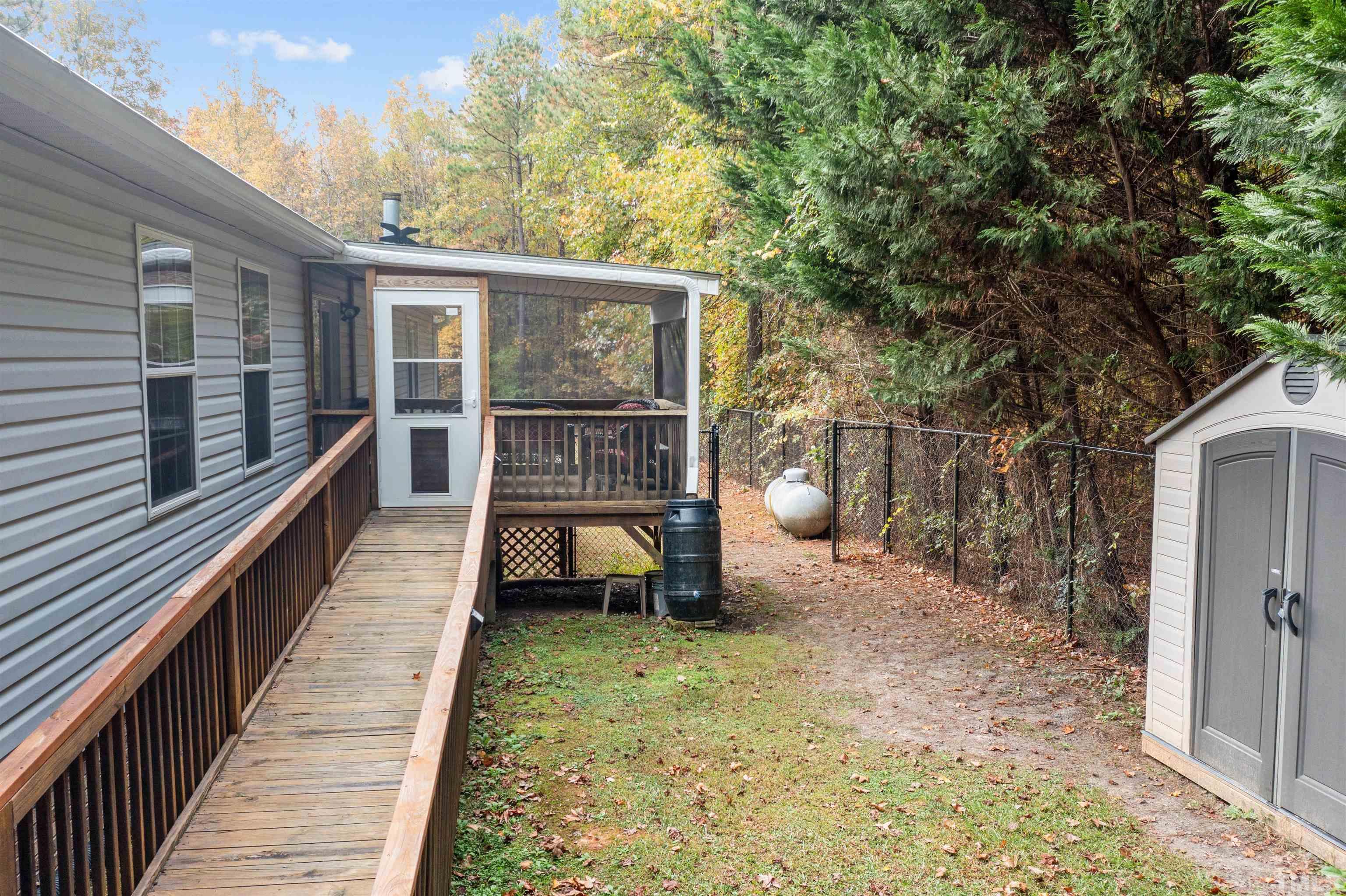 2710 Hurdover Road Apex, NC 27539 - Photo 42 of 52 a view of a house with backyard and sitting area