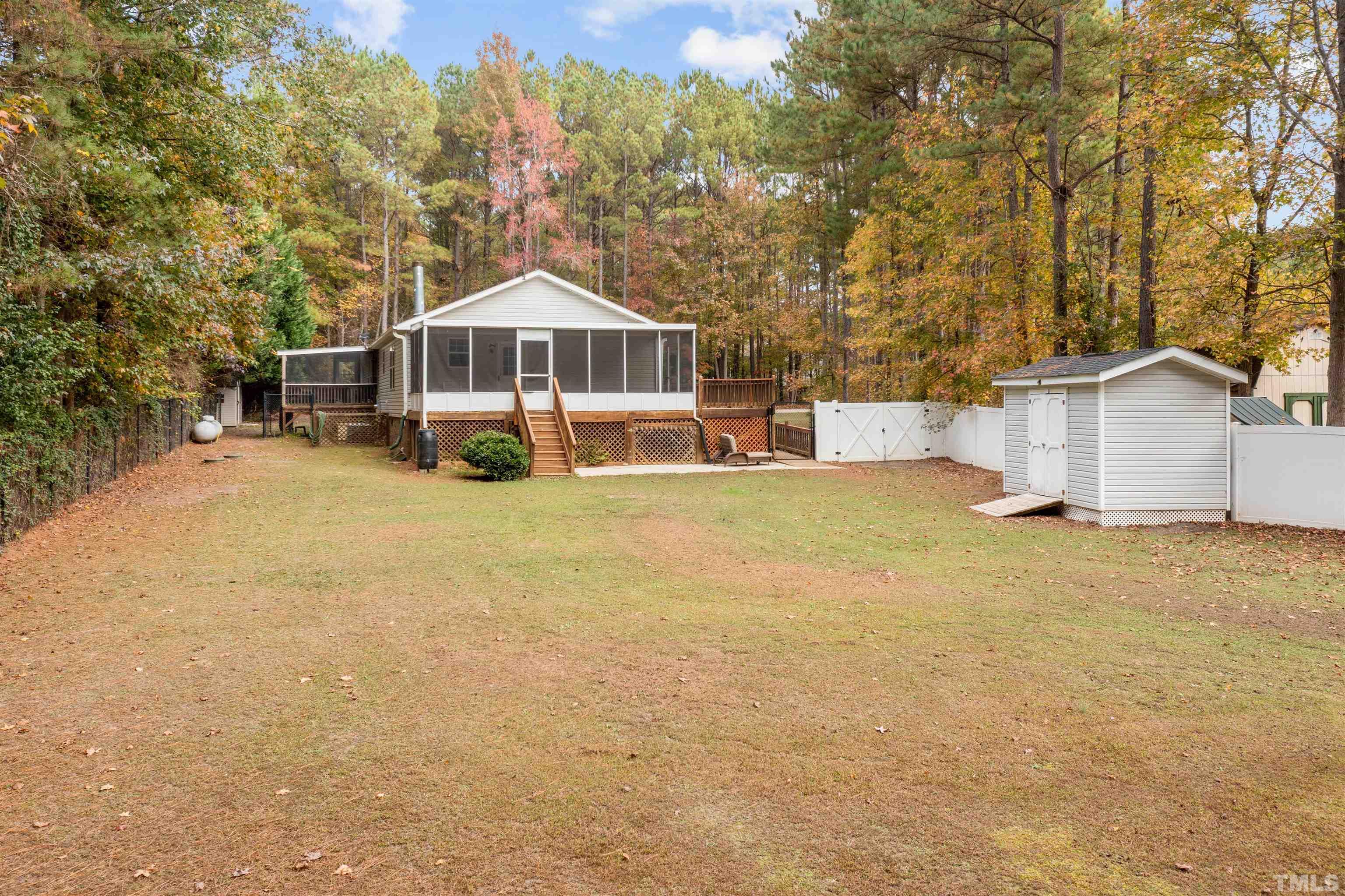 2710 Hurdover Road Apex, NC 27539 - Photo 47 of 52 a view of a house with a yard
