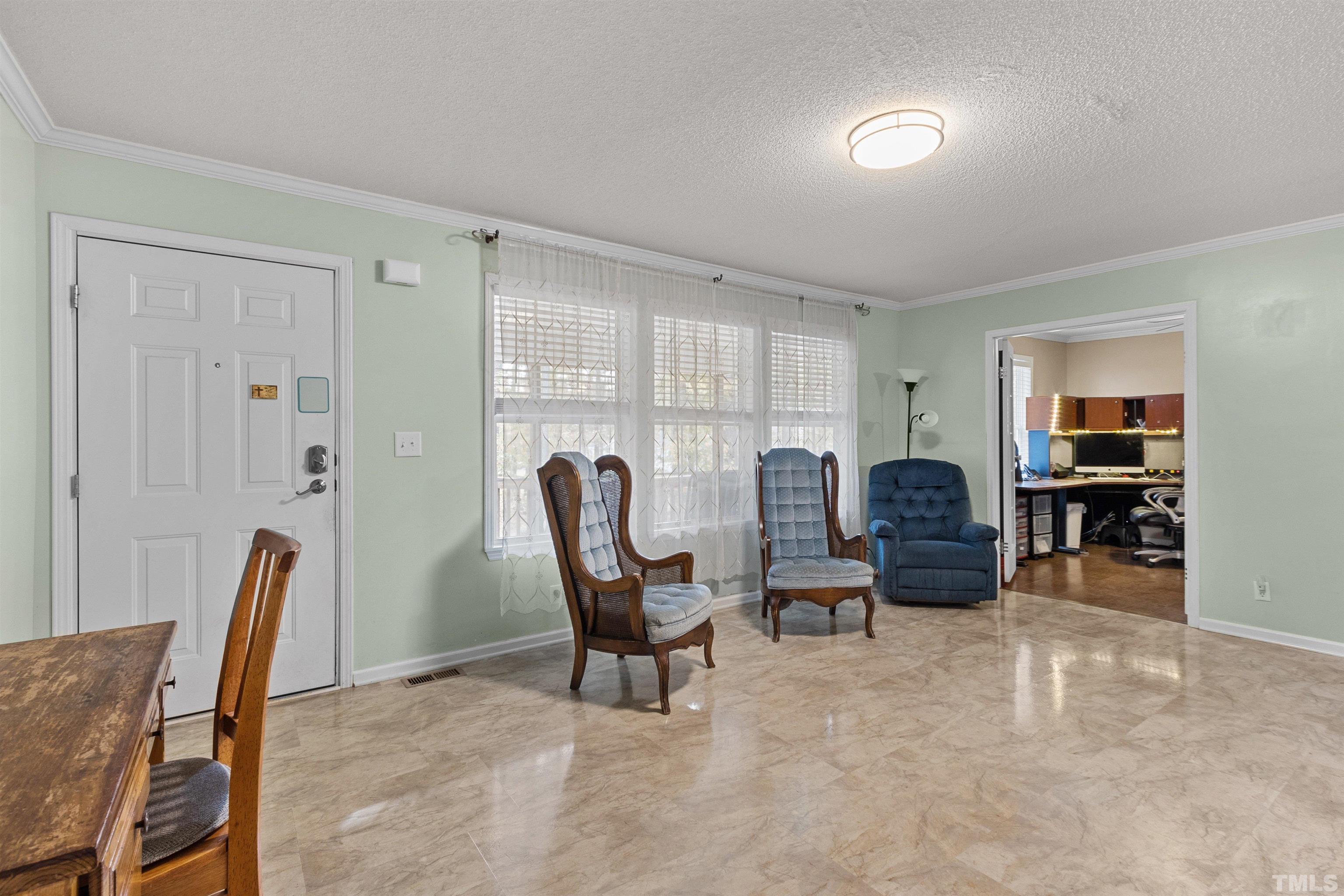 2710 Hurdover Road Apex, NC 27539 - Photo 5 of 52 a view of a workspace with furniture and a window