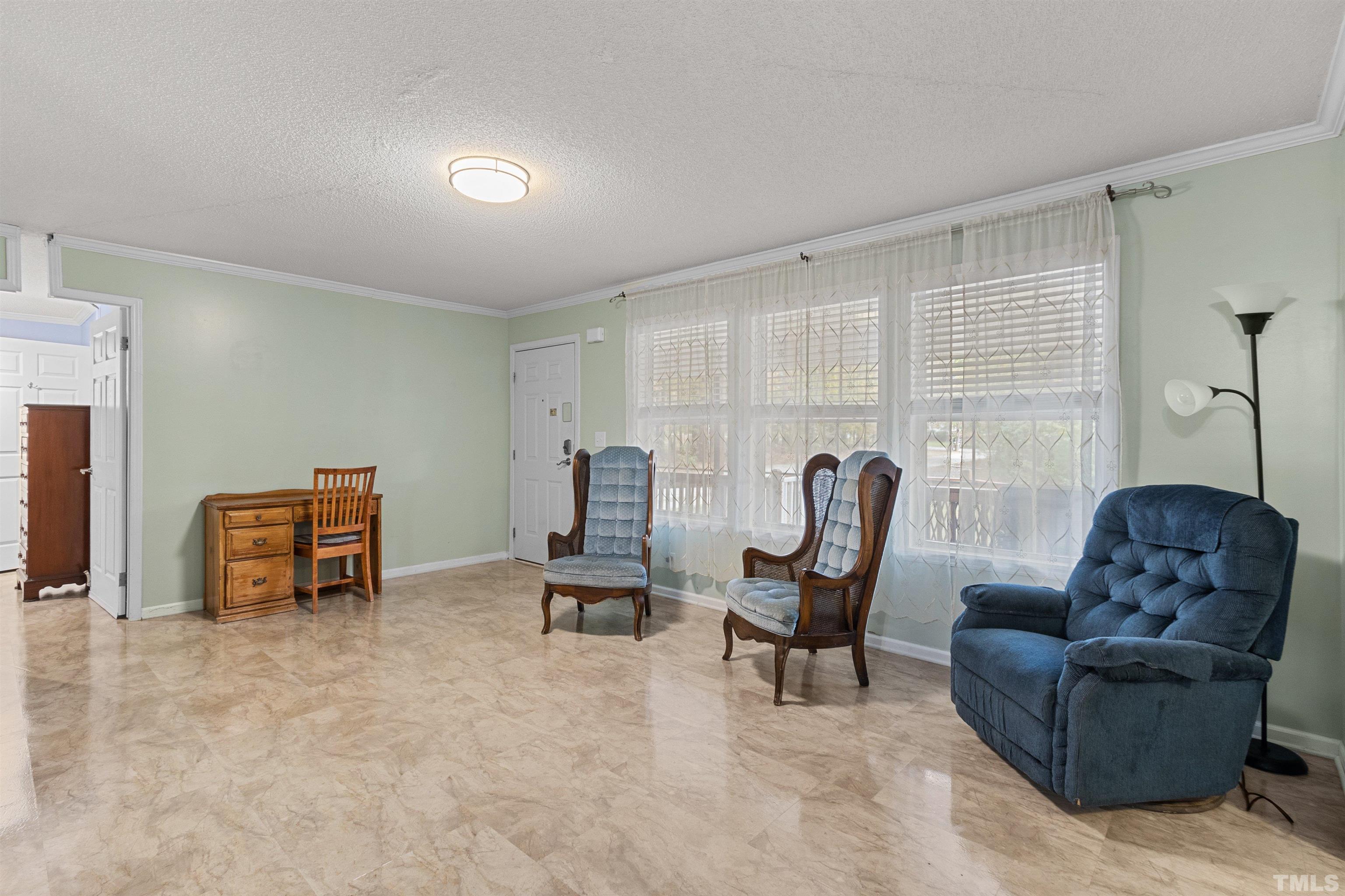 2710 Hurdover Road Apex, NC 27539 - Photo 6 of 52 a living room with furniture and a window