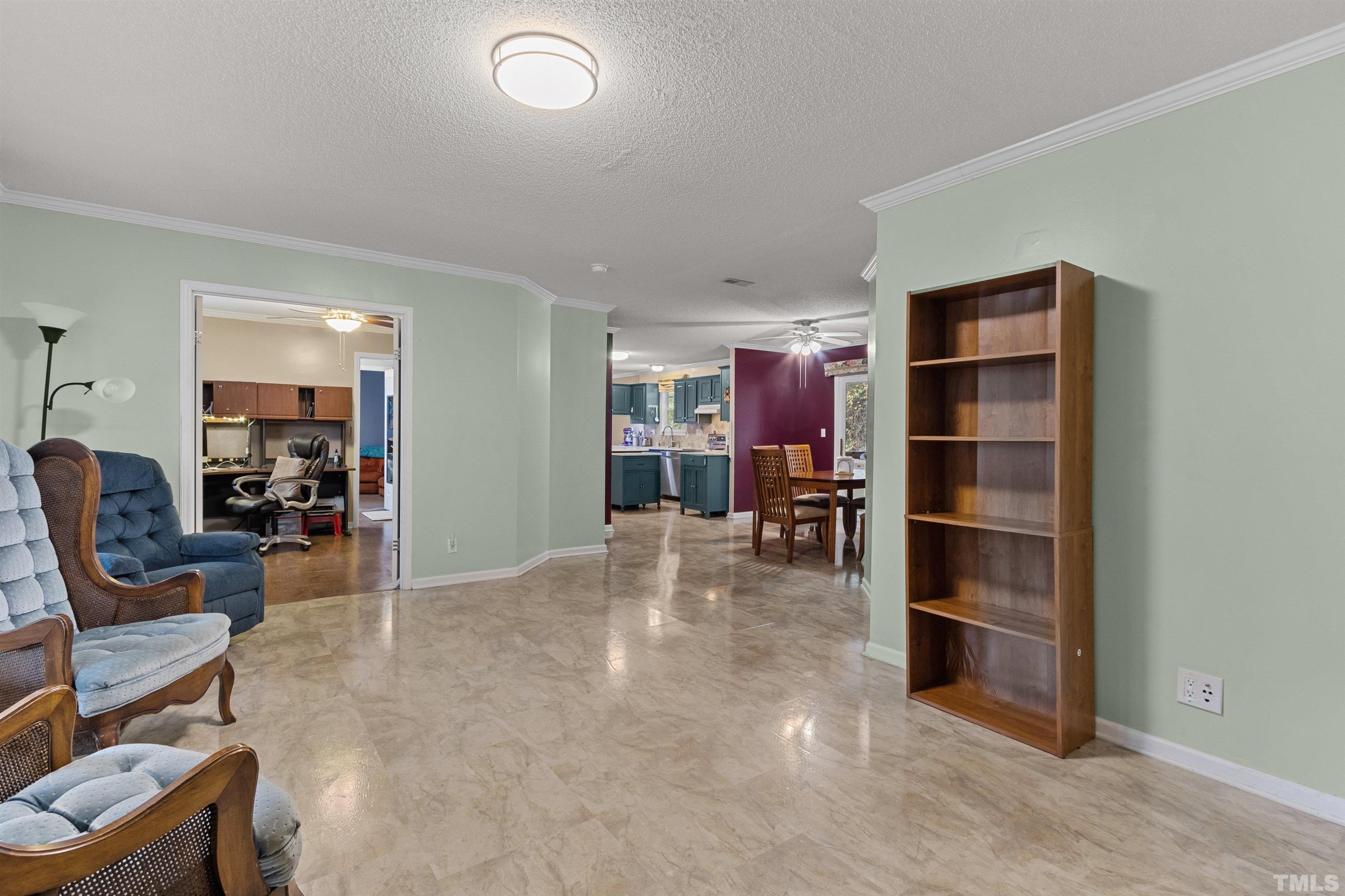2710 Hurdover Road Apex, NC 27539 - Photo 7 of 52 a view of living room kitchen and a window