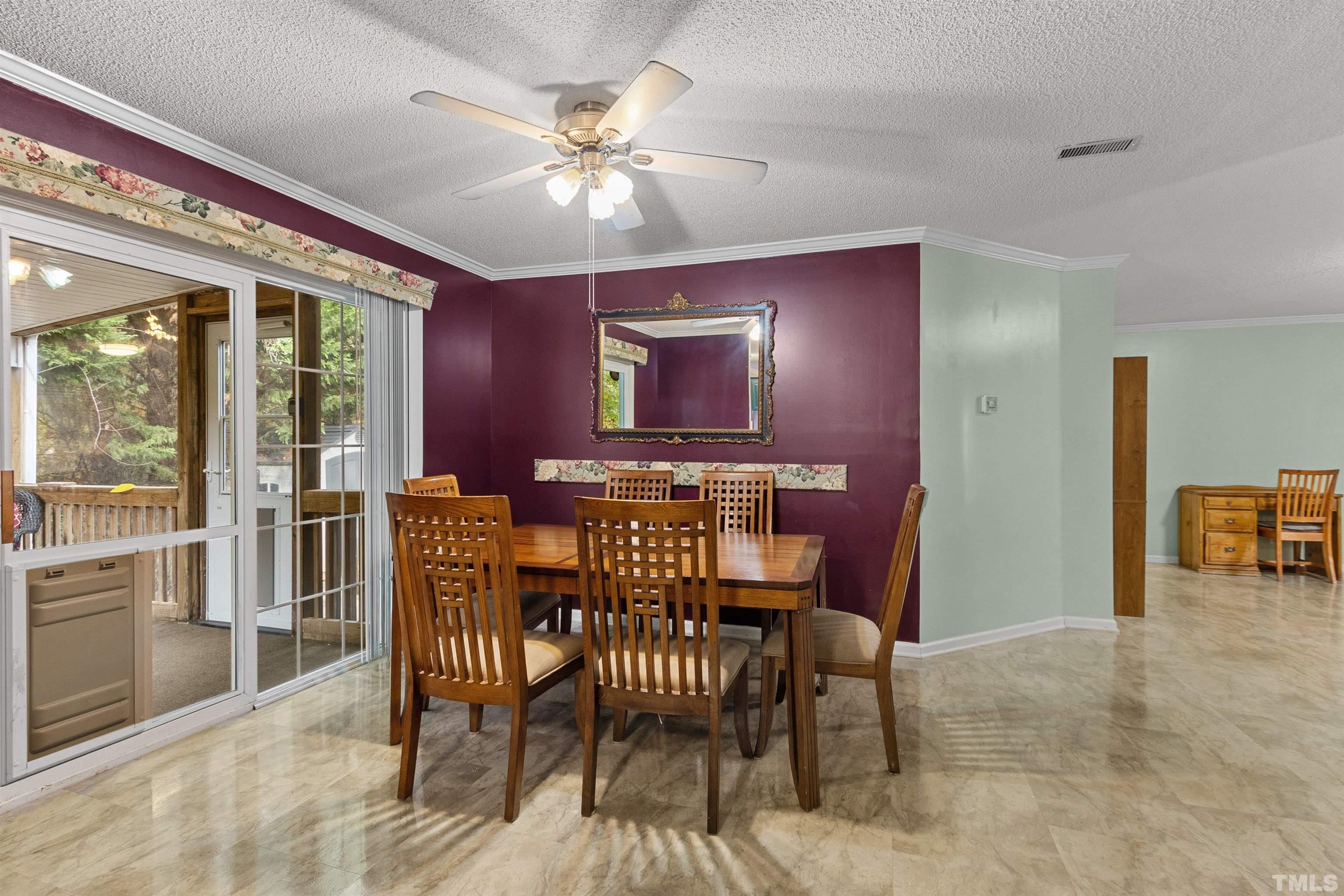 2710 Hurdover Road Apex, NC 27539 - Photo 8 of 52 a view of a dining room with furniture and chandelier