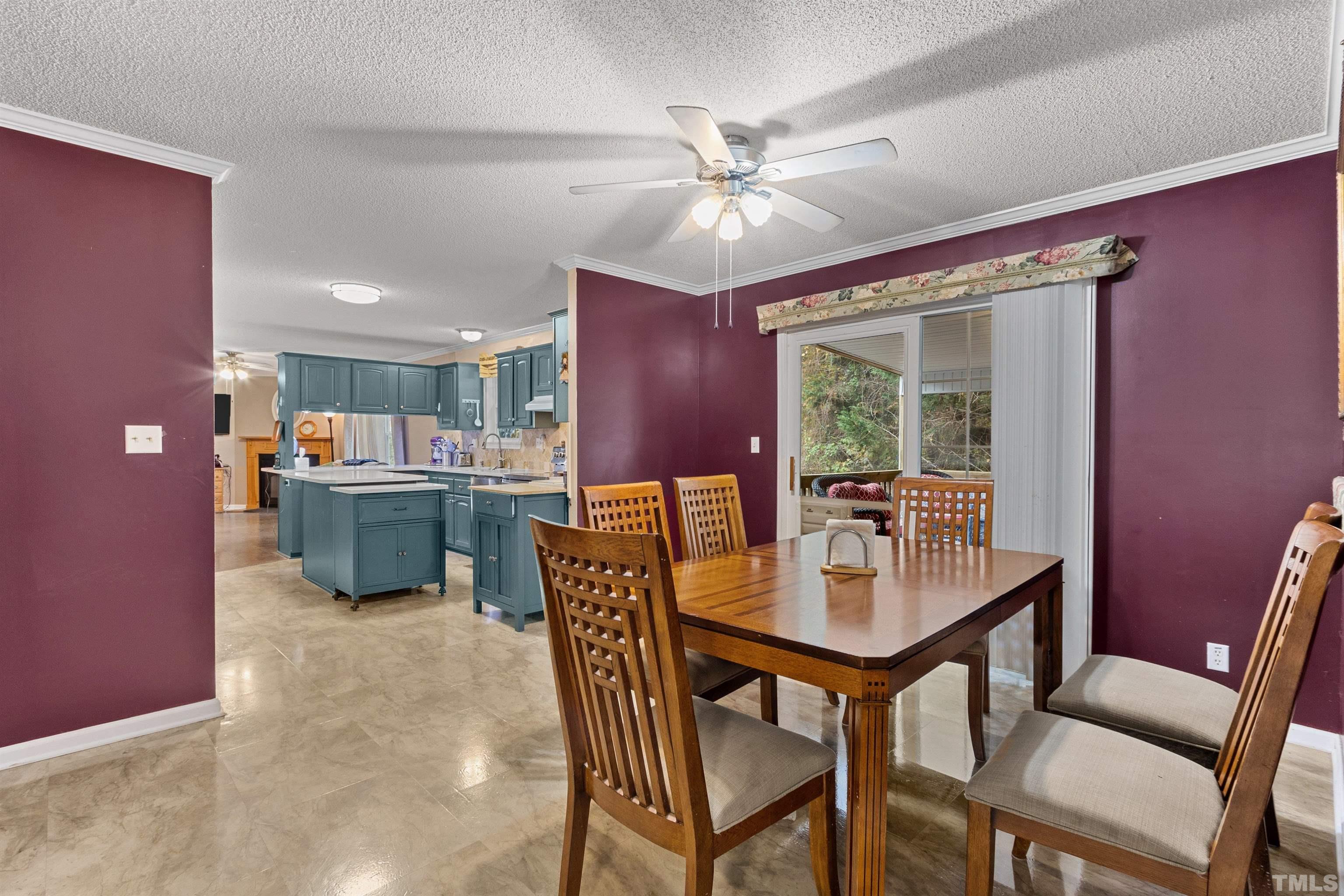 2710 Hurdover Road Apex, NC 27539 - Photo 9 of 52 a dining room with a wooden table and chairs
