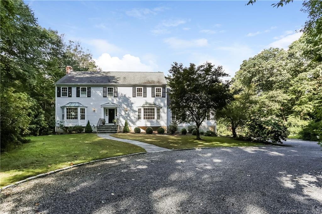 280 Cheese Spring Road Wilton, CT 06897 - Photo 1 of 1 a view of a house with a big yard and large trees
