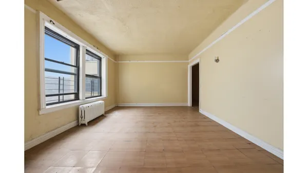 a view of an empty room with a window