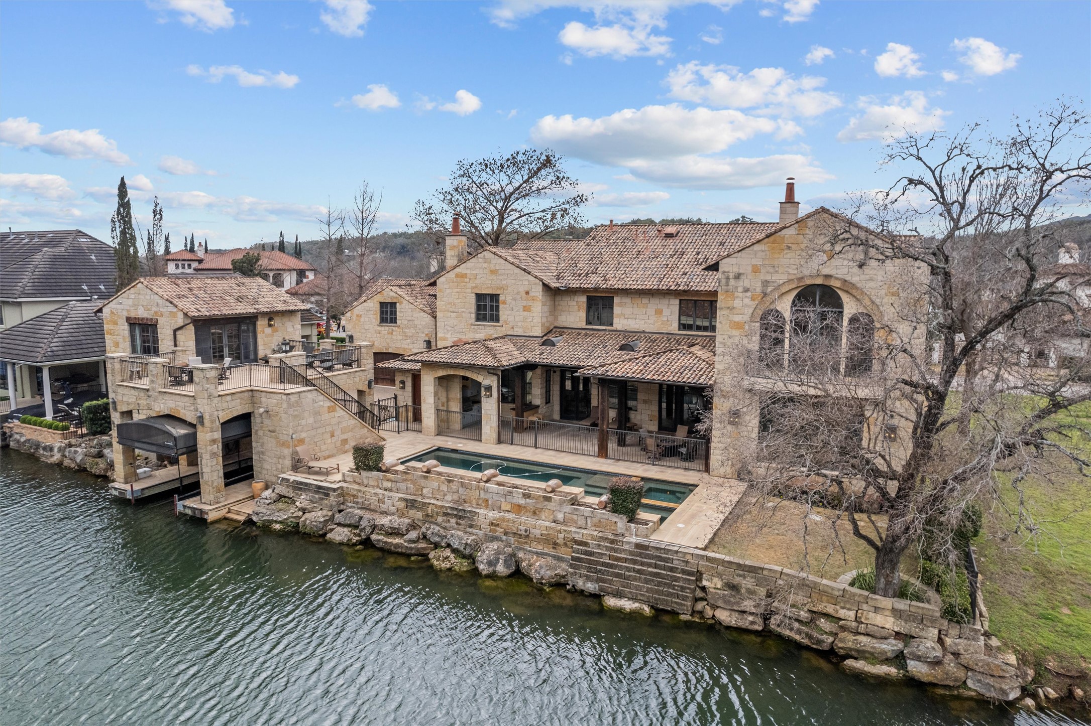 4407 Island Cove Austin, TX 78731 - Photo 23 of 40 Imagine waking up to the gentle sound of water lapping against the shore or hosting sophisticated soirées under the stars by your sparkling pool