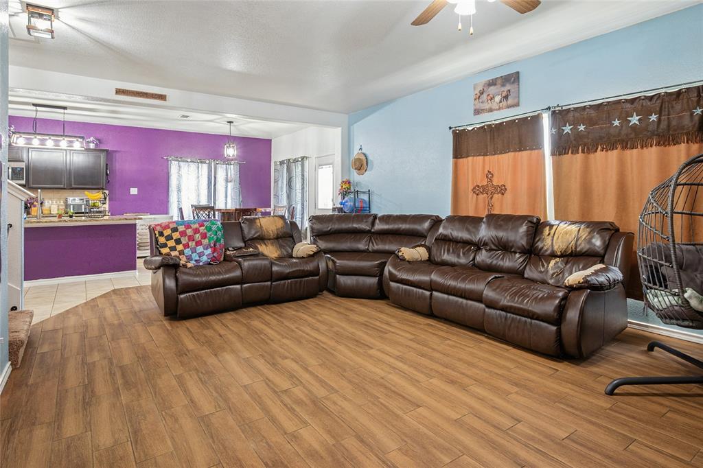 324 Fairgrounds Lane Ponder, TX 76259 - Photo 5 of 40 a living room with furniture and a flat screen tv